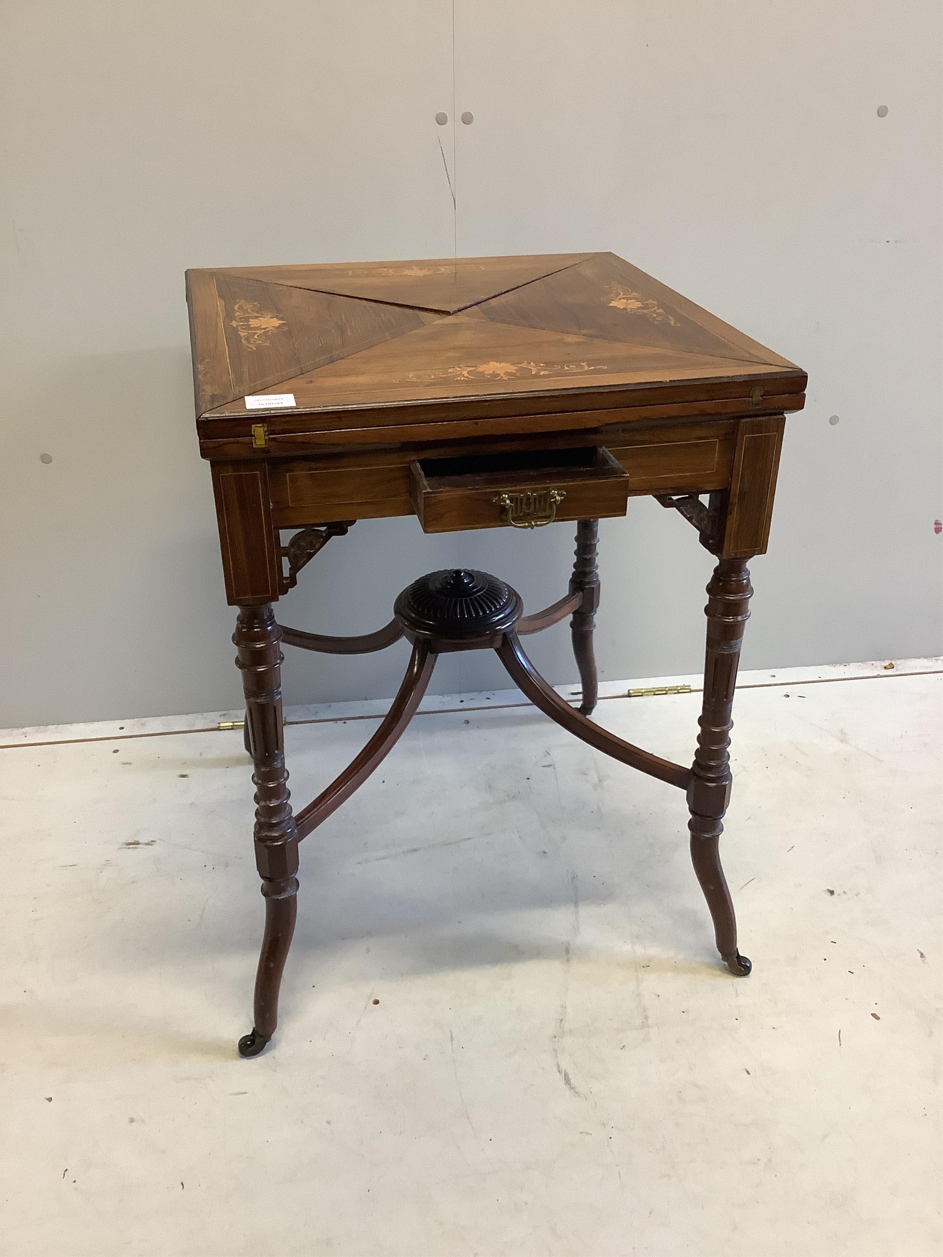 An Edwardian inlaid rosewood envelope card table, width 54cm, depth 54cm, height 74cm. Condition - fair